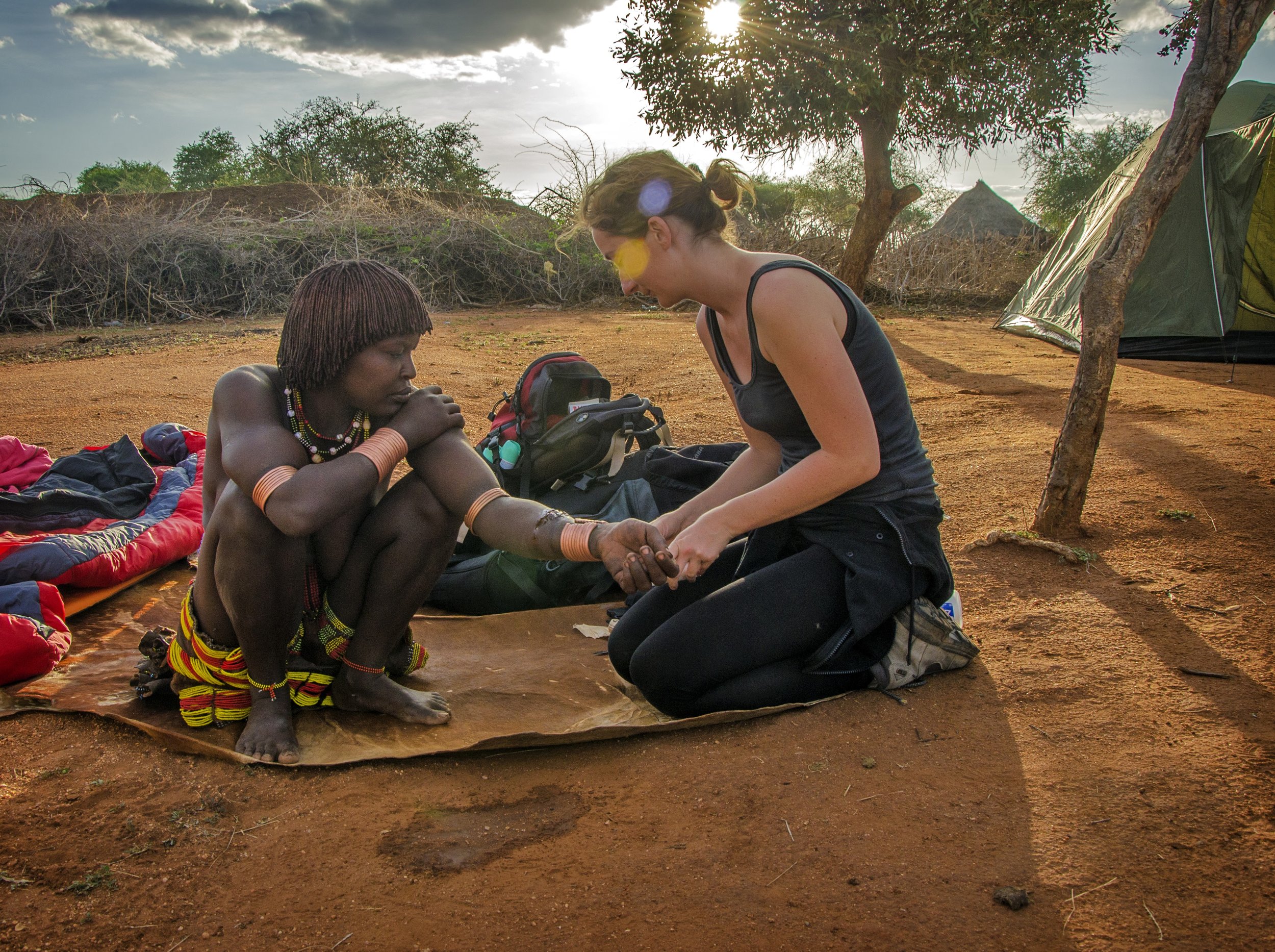 Treating a Hamar woman's arm, Ethiopia
